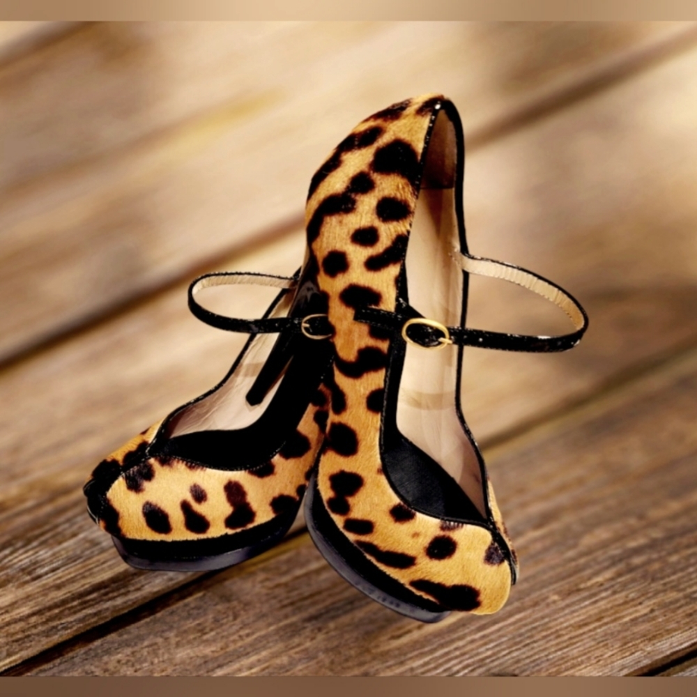 YSL Tribute Animal Print Ponyhair Stiletto Heels with Black Patent Leather Trim.